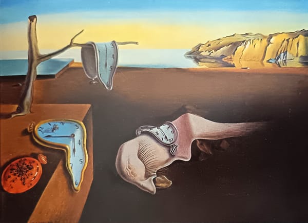 Salvador Dalí's The Persistence of Memory, featuring melting clocks in a dreamlike landscape.