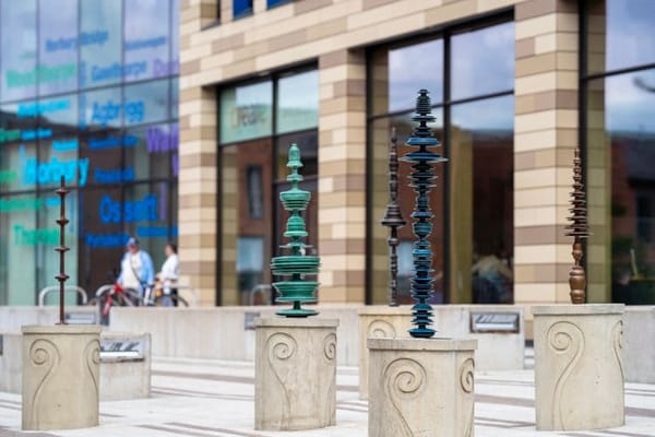 Bronze spiral sculptures on plinths outside the Wakefield One building prior to their theft.